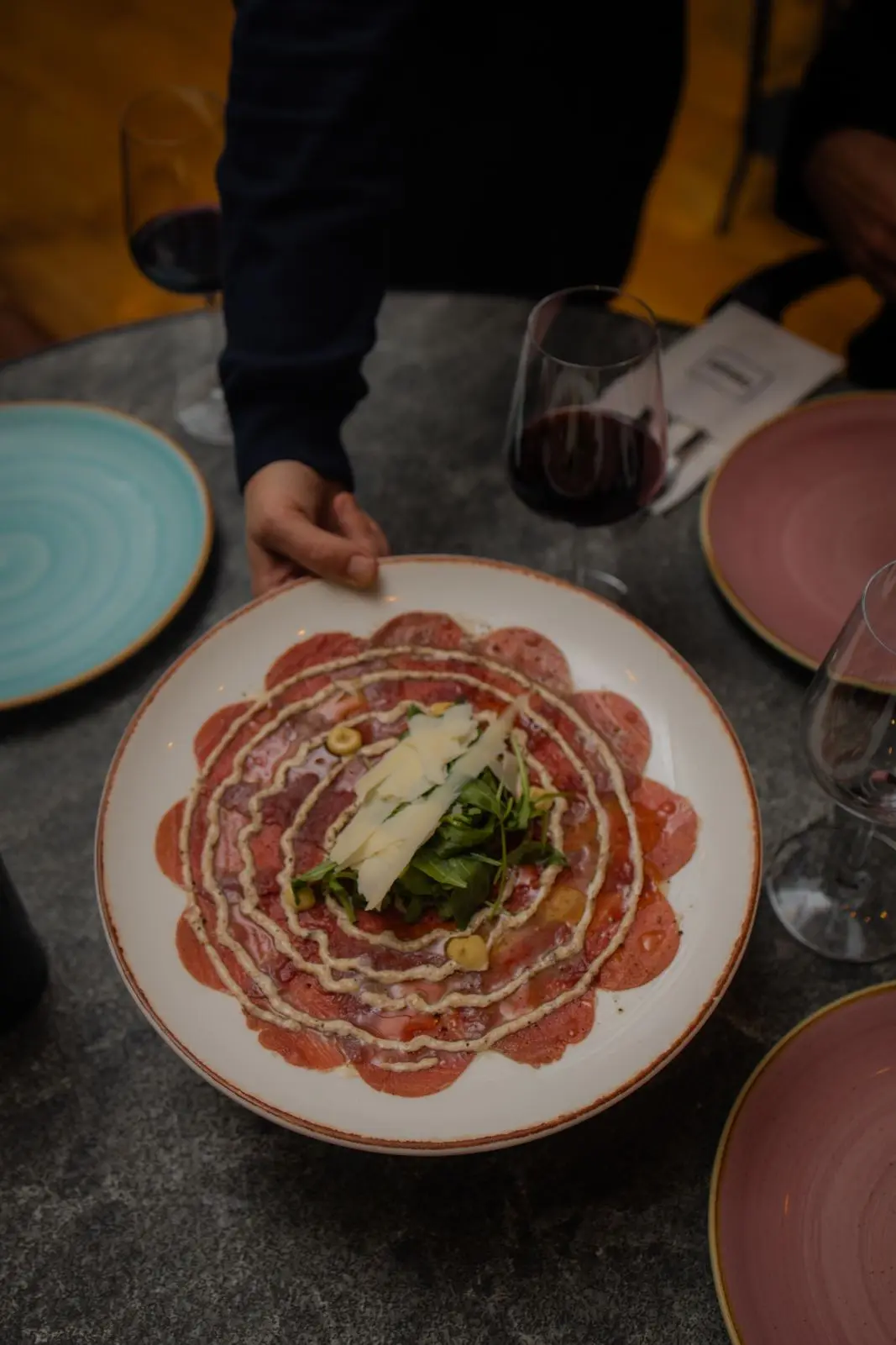 Elegant beef carpaccio with delicate garnish
